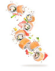 Wall Mural - Pieces of sushi frozen in the air in high resolution, isolated on white background