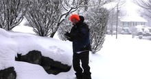 Man Throwing Snowball Outdoor On Snowy Winter Afternoon.