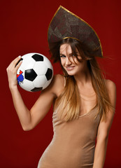 Wall Mural - Ruusian style Fan sport woman player in kokoshnik hold soccer ball celebrating happy smiling laughing