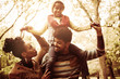 © Mladen - Happy African American family in park together.