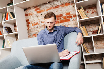 Canvas Print - Young man with a laptop