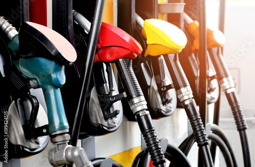 Cuadros en Lienzo red green yellow orange color fuel gasoline dispenser background