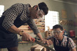 © DragonImages - Sawing wood