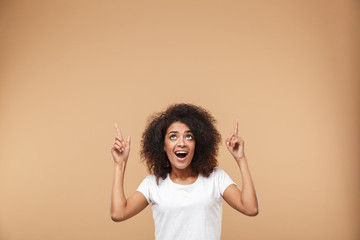 Wall Mural - Portrait of an excited young african woman