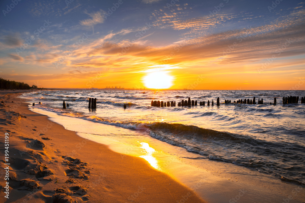 Sunset ovet the Baltic sea beach in Poland - obrazy, fototapety, plakaty 