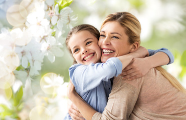 people and family concept - happy smiling mother hugging daughter over cherry blossom background