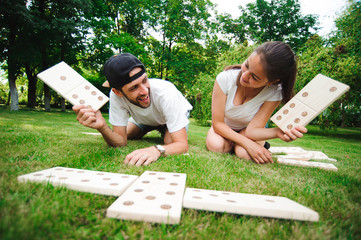 Wall Mural - Domino players on the grass.