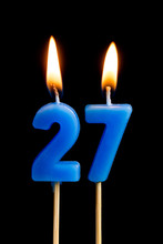 Burning Candles In The Form Of 27 Twenty Seven (numbers, Dates) For Cake Isolated On Black Background. The Concept Of Celebrating A Birthday, Anniversary, Important Date, Holiday, Table Setting