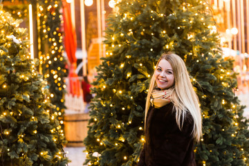 Wall Mural - Portrait in full growth, Russian beautiful woman in a mink coat on the Red Square in Moscow in Christmas time