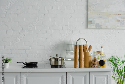 Fotografie, Obraz frying pan and pan on electric stove in light kitchen
