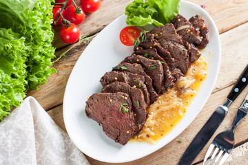 Hanger beef steak with orange sauce