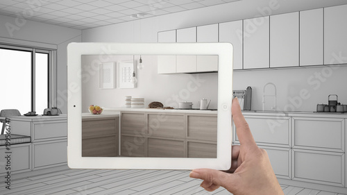 Hand holding tablet showing real finished minimalist white and ... Hand holding tablet showing real finished minimalist white and ...
