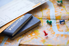 Pins Marking Travel Itinerary Points On Map And Passport