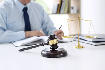 Canvas Print - Judge gavel with scales of justice, male lawyers working having at law firm in office. Concepts of law