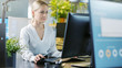 © Gorodenkoff - In the Office Beautiful Businesswoman Working on a Personal Computer at Her Desk. Her Colleague's Computer Screen Shows Infohraphics.