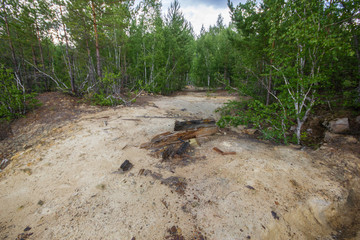 Underground old ore gold mine terricon slagheap rocks heap