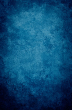 Fototapete - A textured, vintage paper background with a dark blue vignette.
