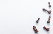 © Станислав Сцепинский - Chess game figures on white background , top view, flat lay copy space
