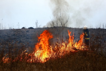 Guard during fire fighting on dry meadows.