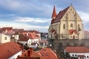 Wall Mural - Aerial view of the old town of Znojmo with St. Nicholas Church, shot on a foggy winter day. Znojmo, South Moravia, Czech Republic.