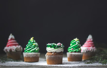 Decorated Christmas Cupcakes, On Wooden Background With Copy Space