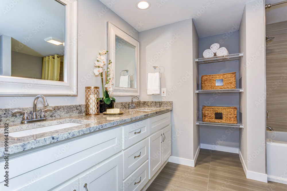 Elegant bathroom with long white vanity cabinet - obrazy, fototapety, plakaty 