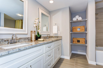 Elegant bathroom with long white vanity cabinet