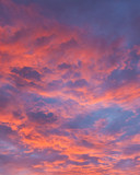 Fototapeta Niebo - Vibrant colorful clouds at sunset