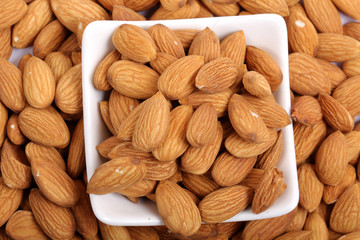 Almonds isolated. Group of almond nuts isolated on white background. Full depth of field