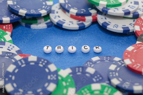 word "trick" with poker chips , gambling concept Poster