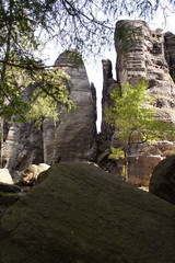 Rock mountain ruins with some trees around.