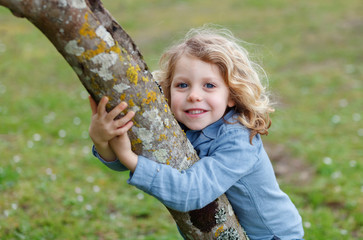 Canvas Print - Happy child with long blond hair enjoying the nature