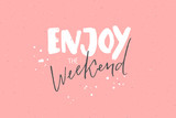 Fototapeta  - Enjoy the weekend. Inspirational caption, handwritten text on pastel pink background