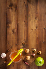 Wall Mural - glass jar of honey on wood