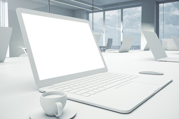 Poster - Side view of empty white laptop on workplace