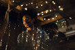 © Rendara Studio - Indian ethnicity DJ laughing during a tropical party in the caribbean in Santa Marta, Colombia