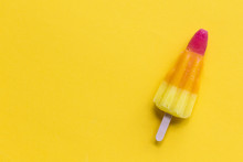 Rocket Shaped Summer Ice Lolly On A Bright Yellow Background