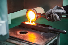 Melting Gold. Molted Metal Pouring Into Bar Form
