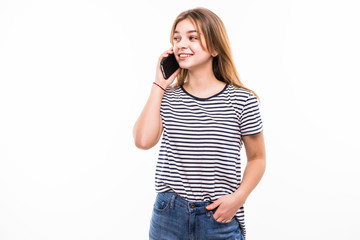 Young happy caucasian teen girl is calling with a mobile phone isolated on white