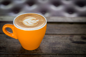 Wall Mural - cup of coffee on wood table