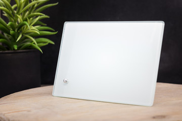 Poster - Blank photo frame on wooden backdrops. Transparent picture frame for your design. Interior decoration.