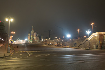 Night Moscow image. Cloudy. Night lights of city do colorful the night in Moscow. Temple of Vasily Blazhenny view / Cathedral of St. Basil the Blessed view