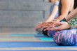© uv_group - Close up of yoga class with meditate hands with mudra sign. Group of men and women doing lotus pose, meditation in studio. Healthcare, lifestyle concept.