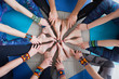 © uv_group - Close up of hands and legs of Group of sporty happy people sitting on the gym floor in a circle together, resting and meditating after yoga class with instructor indoors. Healthy lifestyle concept