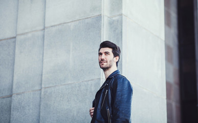 Wall Mural - Photo of handsome man in black leather jacket