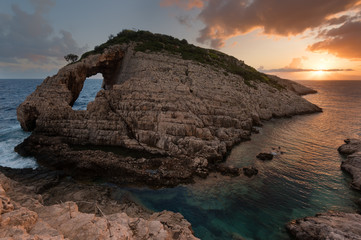 Wall Mural - Landscape view of rocky formations Korakonisi in Zakynthos, Greece.Beautiful summer sunset, magnificent seascape.