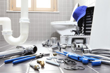 Plumber Tools And Equipment In A Bathroom, Plumbing Repair Service, Assemble And Install Concept