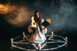 Witch in pentagram circle, dark magic ritual
