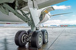 Wheels rubber tire rear landing gear racks airplane aircraft, under wing view.