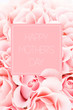 Pink greeting card of roses with inscription “Happy mother’s day”